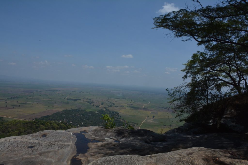 View from a rocky escarpment over the farmland plains, Udzungwa Mountains National Park