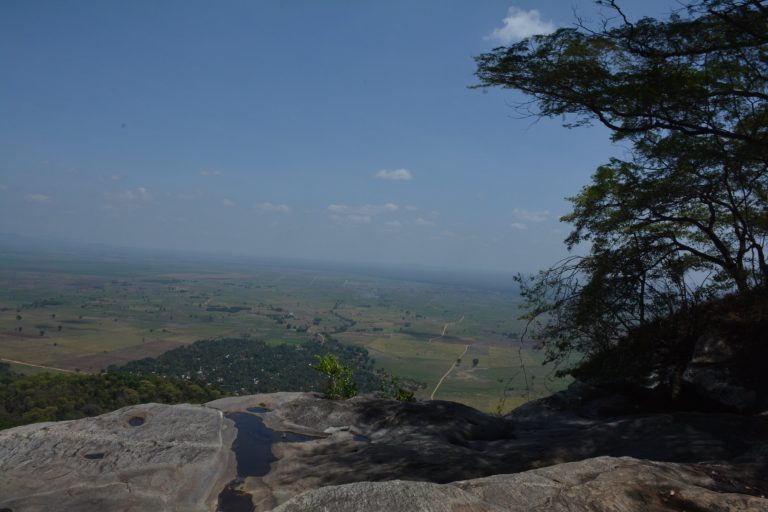 View from a rocky escarpment over the farmland plains, Udzungwa Mountains National Park